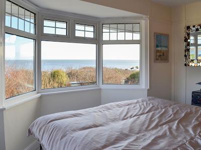 Bedroom now has beige curtains all round